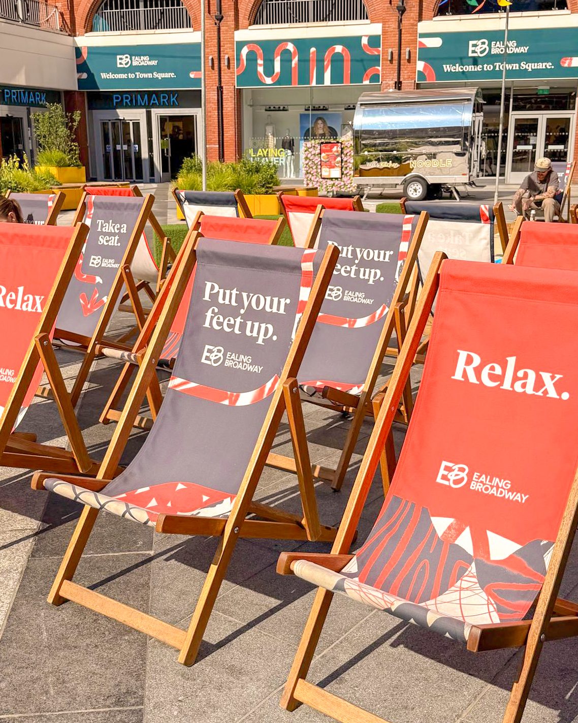 Branded Ealing Broadway deckchairs printed with Relax and Put your feet up messaging
