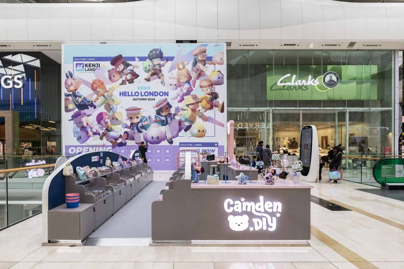 Camden DIY illuminated accessories kiosk at Westfield London with backlit branding panels by OLLYWOOD