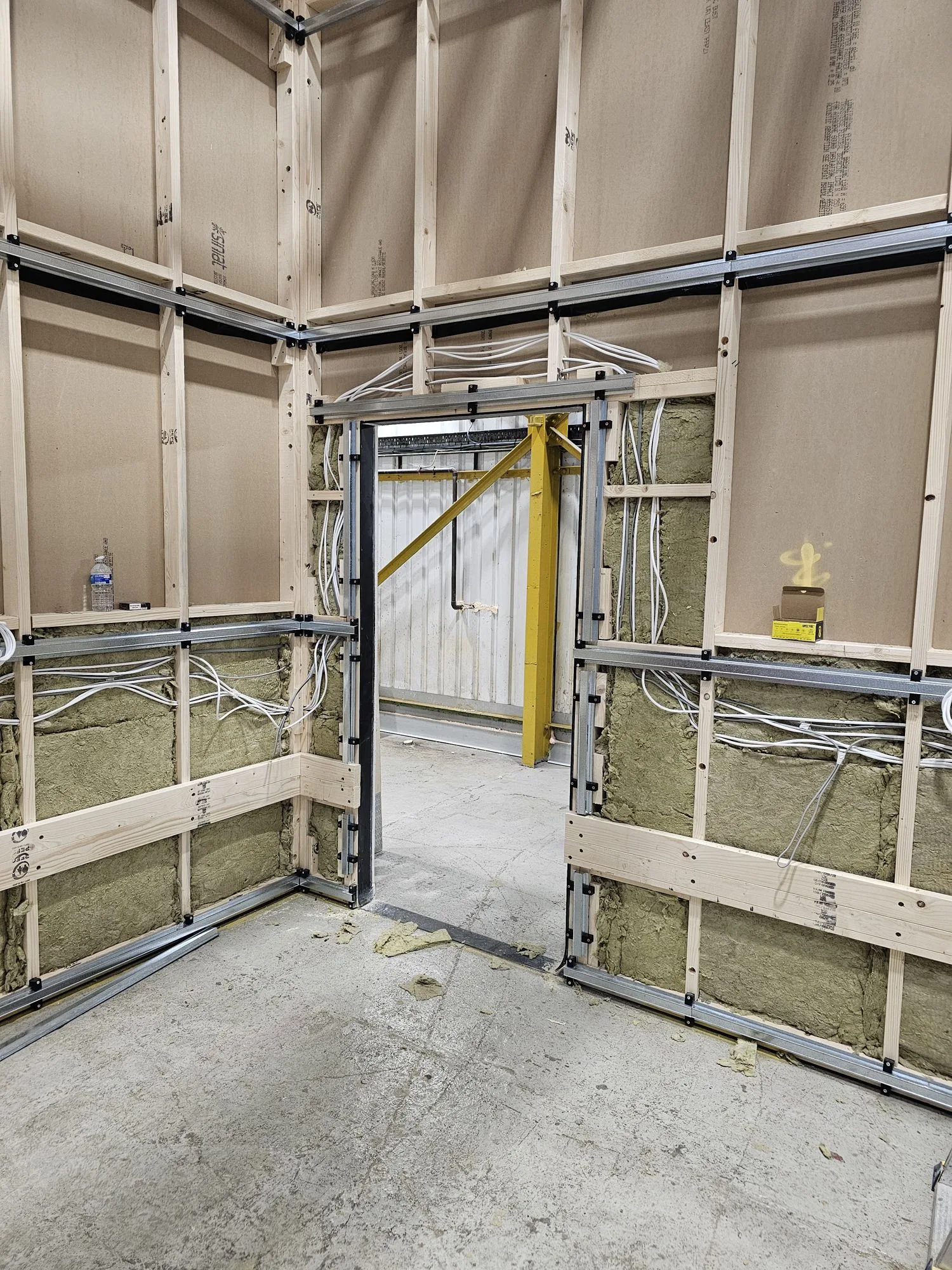 Stud framing with first fix electrics and services routed through the Gelert post production studio build