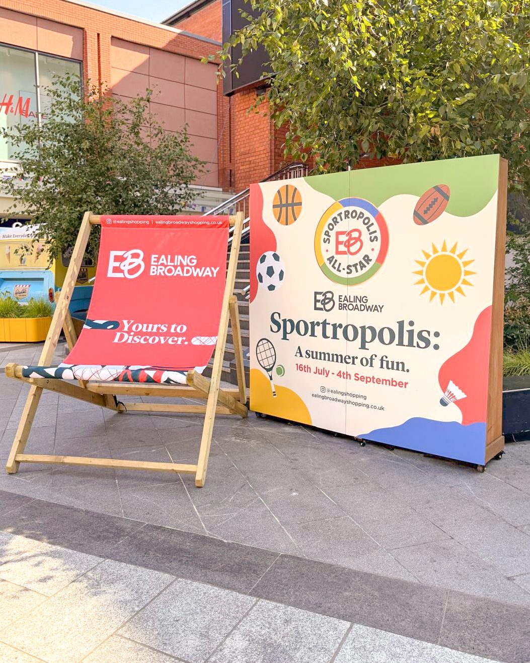 Sportropolis event signage board and oversized branded deckchair at Ealing Broadway