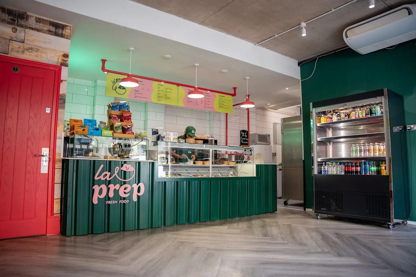 Bespoke cafe servery counter with timber panelling and warm lighting, built by OLLYWOOD for La Prep