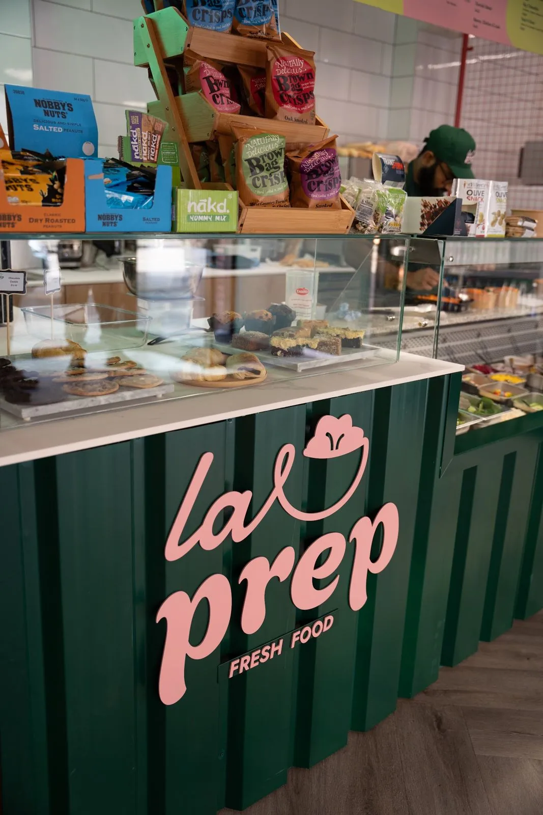 Refrigerated deli display case in a cafe counter