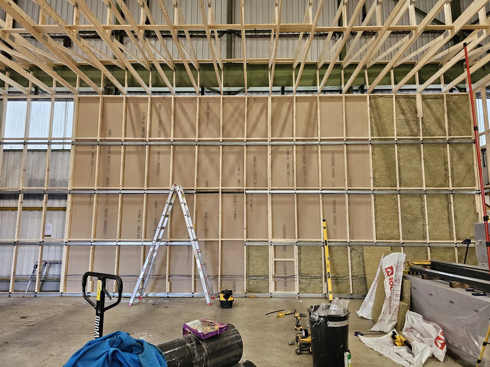Dense acoustic insulation packed into the timber walls of the Gelert studio in Cardiff